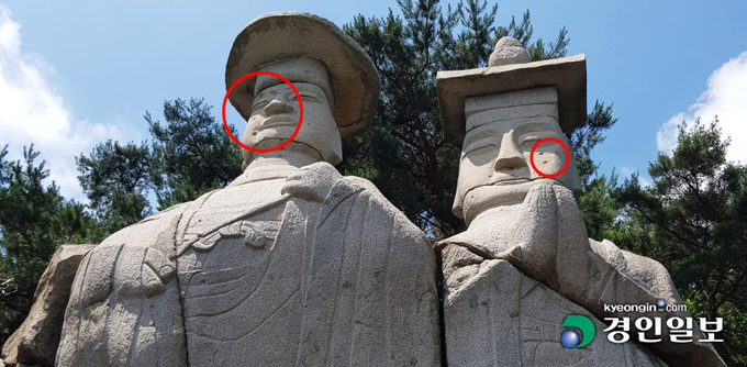 파주 용미리 마애이불입상(보물 제93호). 동그라미속 파인 흔적들은 한국전쟁 때 생긴 총탄 자국이 남아 있는 것으로 추정된다. /이원근기자 lwg33@kyeongin.com