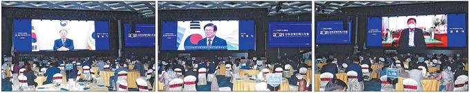 지난 30일 열린 2021 강원경제인페스티벌에서 참석자들이 영상 강연과 축하 메시지를 경청하고 있다. 왼쪽 사진부터 홍남기 경제부총리, 박병석 국회의장, 윤후덕 국회 기획재정위원장. 정선=박승선기자